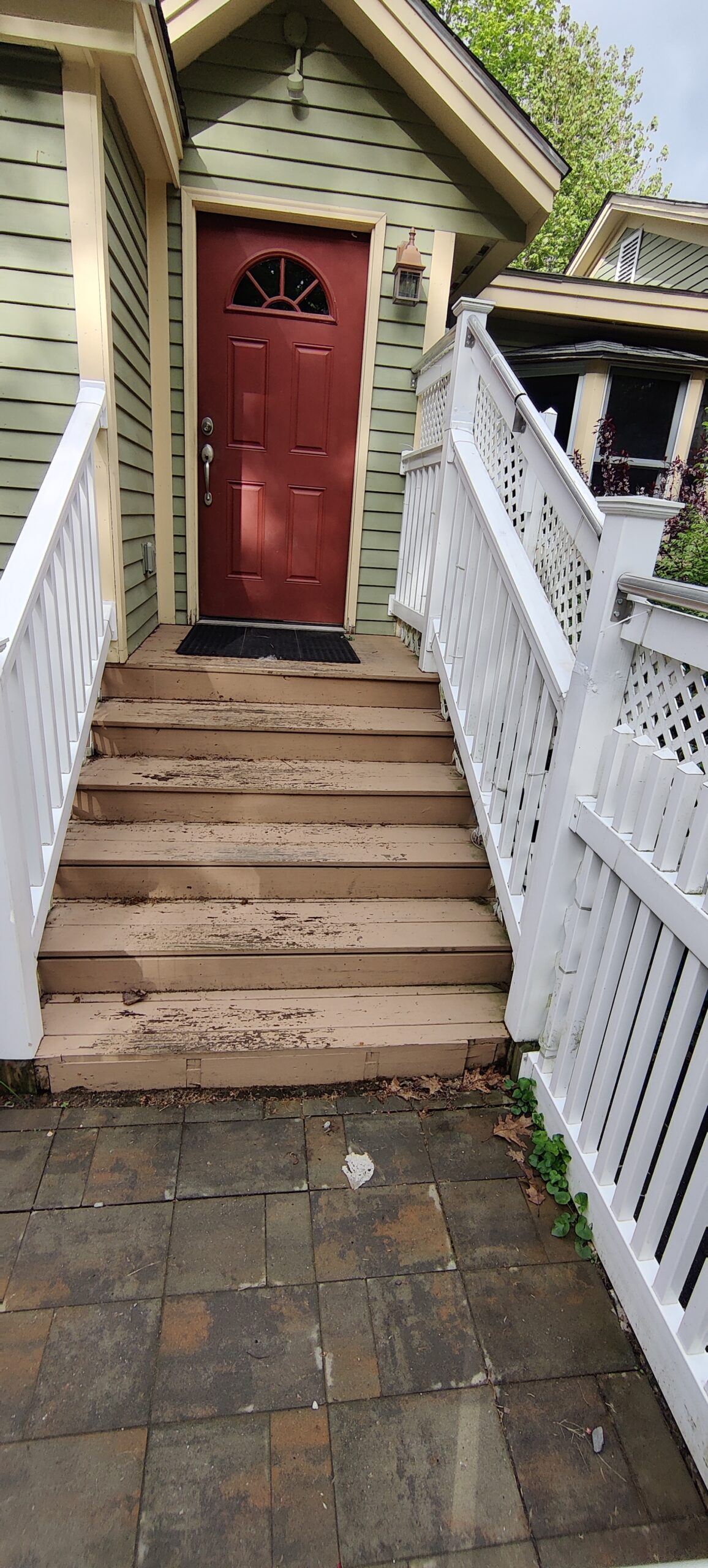 Original entry door and porch before the Troy front-entry transformation.