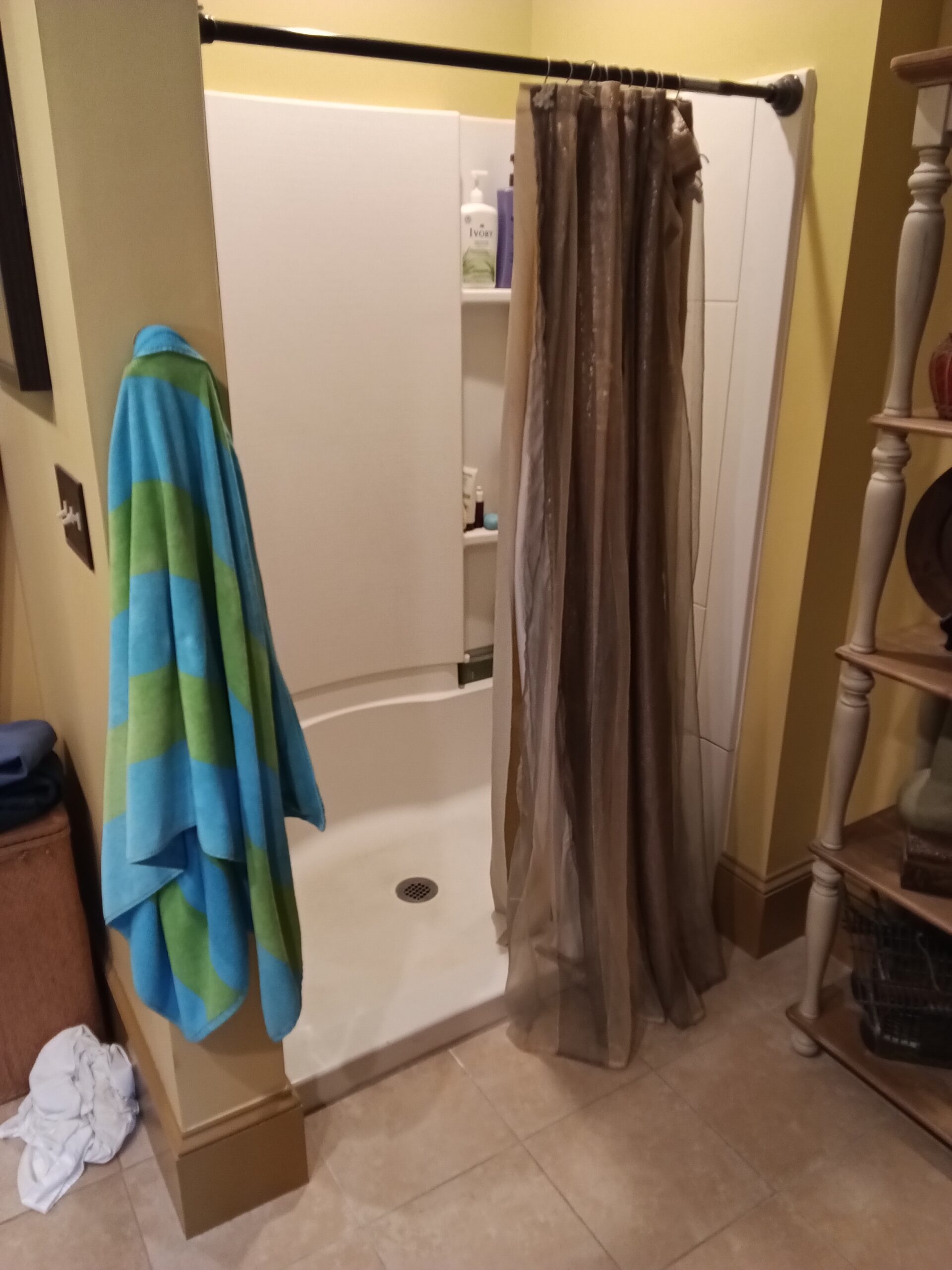 Shower opening with a curtain before the door enclosure was installed in West Chesterfield, NH.